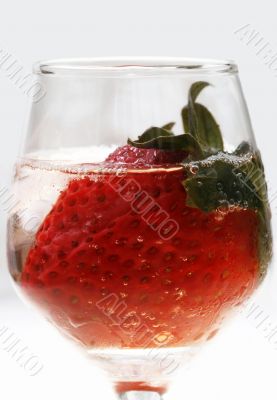 Strawberry in glass and ice