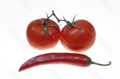 Red chilli and two tomatoes