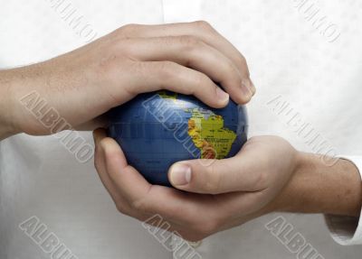 Businessman holding globe