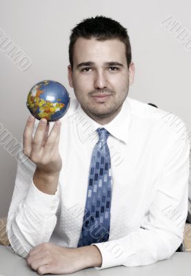 Businessman holding globe