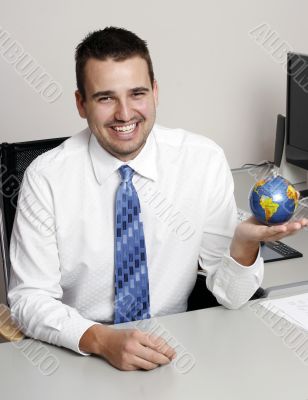 Businessman holding globe