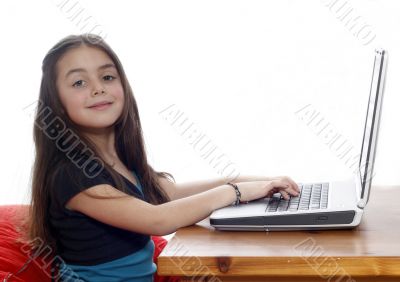 Young girl in front of a laptop