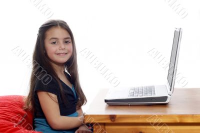 Young girl in front of a laptop