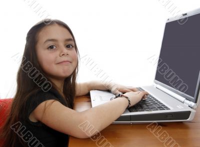 Young girl in front of a laptop