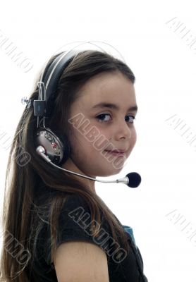 Young girl with headphones smiling at camera