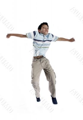  Young boy jumping up isolated on white