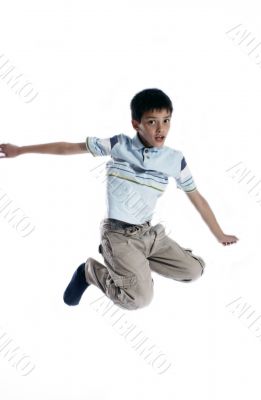  Young boy jumping up isolated on white