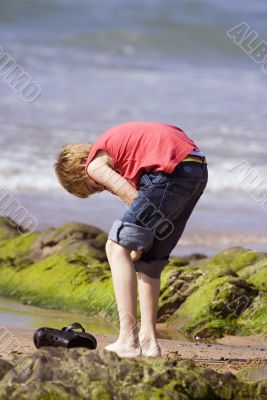 child paddling at beach