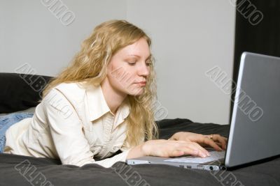 Woman on Bed with Laptop.