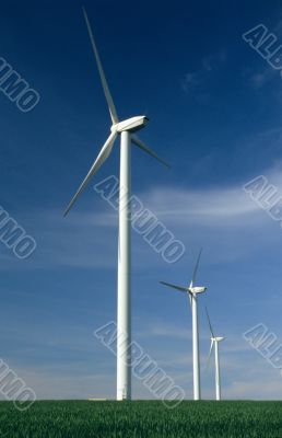 Three windturbines on blue sky