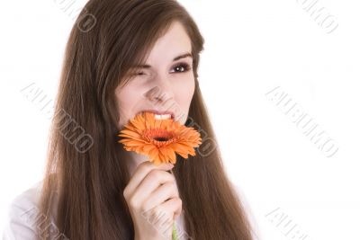 portrait of attractive girl eating flowers