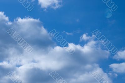 blue sky with clouds and the moon