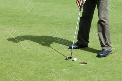 Final putt on golf course