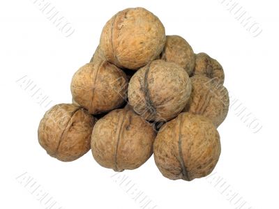 Pyramid from walnuts isolated over white background