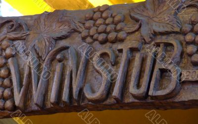 Wood sign of a winstub, winebar in Alsace