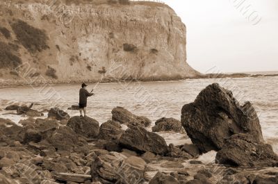 Fishing on a Rocky Beach sepia