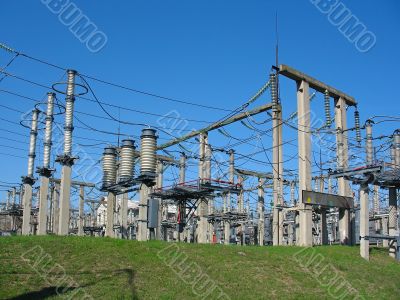 high-voltage substation on blue sky background with switch and connectors