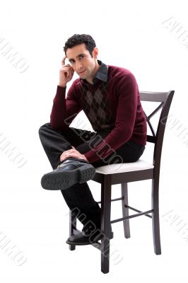 Handsome guy sitting on chair