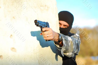 terrorist with mask and gun