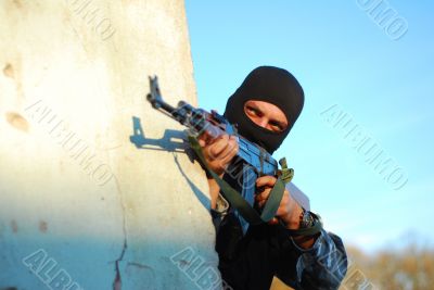 terrorist with mask and gun