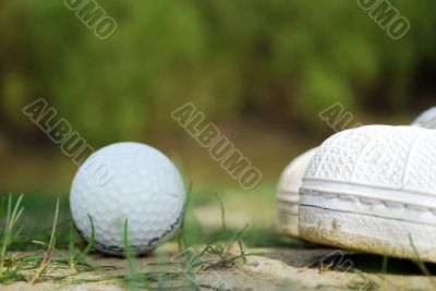 golf ball and shoes