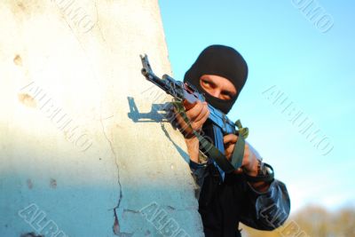 terrorist with mask and gun