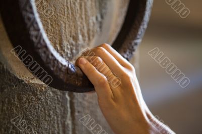 Woman knocking on a clapper