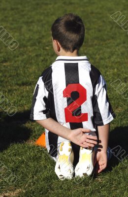 boy watching a soccer match