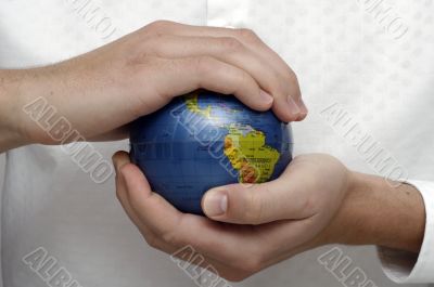 Businessman holding globe