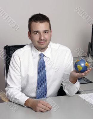 Businessman holding globe