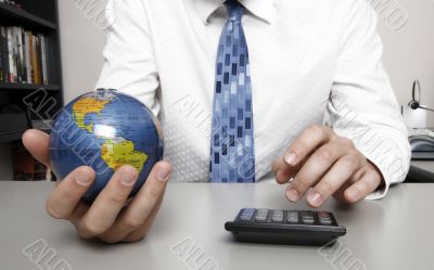 Businessman holding globe