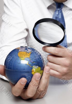 Businessman holding globe