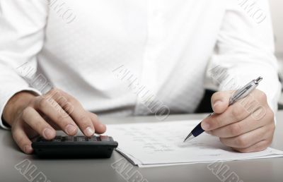 businessman calculating expenses at tax time