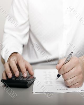 businessman calculating expenses at tax time