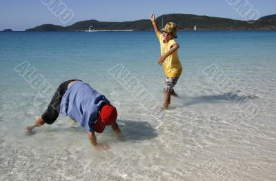 playing at the whitehaven beach