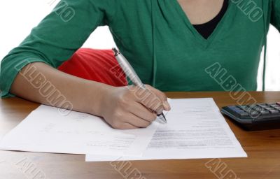 young woman holding a pen