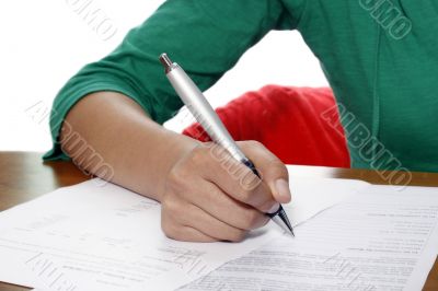 young woman holding a pen