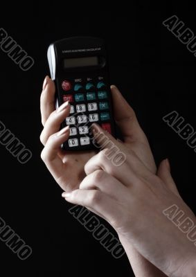 woman uses a calculator