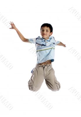  Young boy jumping up isolated on white