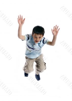  Young boy jumping up isolated on white