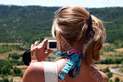 Blonde woman with digital camera