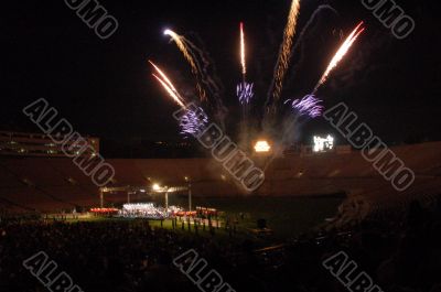 Fireworks lighting stadium at night