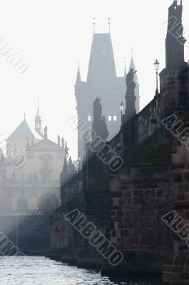 Charles bridge in the early morning fog