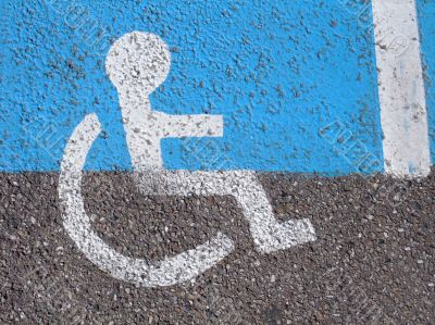 Logo on asphalt for disabled persons