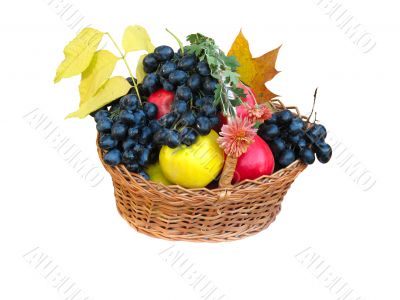 wooden basket with autumn harvest fruit vegetables flowers and leaves