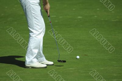 Golfer putting a golf ball