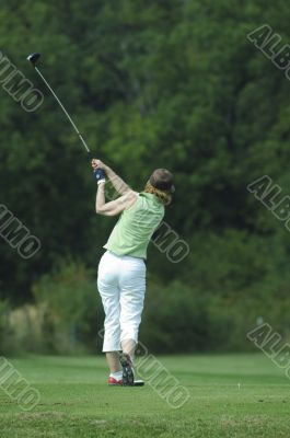 Woman golfer doing a swing