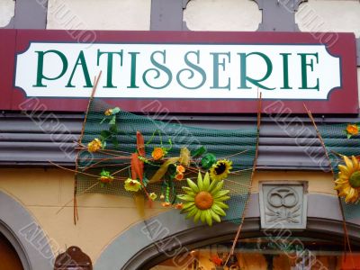 Outdoor sign of a french cake shop - France