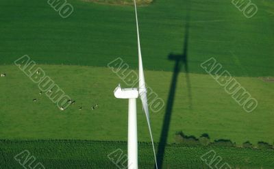 aerial view of windturbine and green meadow