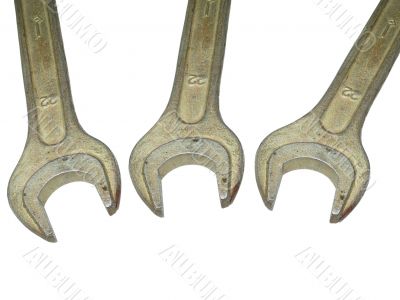 Three old spanner wrench isolated over white background